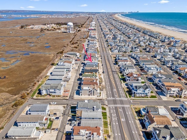 aerial view featuring a water view and a view of the beach