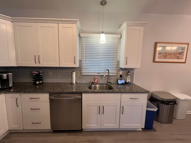 kitchen with dishwasher, white cabinetry, sink, and decorative light fixtures