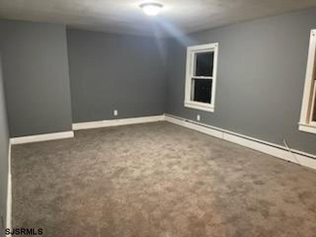 empty room with carpet flooring