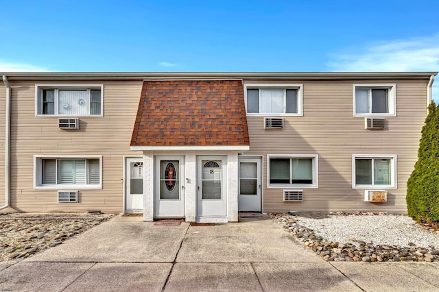 multi unit property featuring a patio area