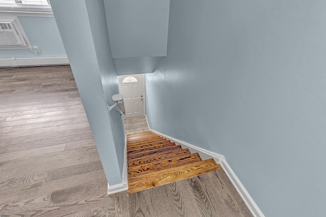 stairway with wood-type flooring