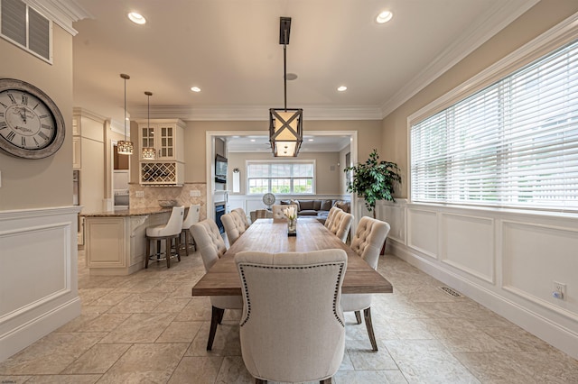 dining room with ornamental molding