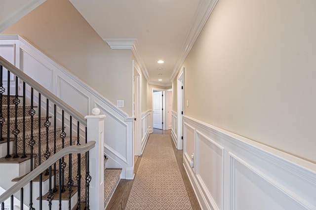 hall featuring crown molding and hardwood / wood-style flooring