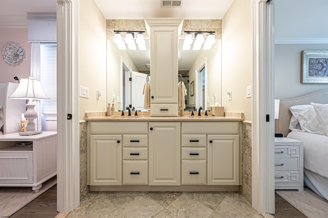 bathroom featuring vanity and ornamental molding