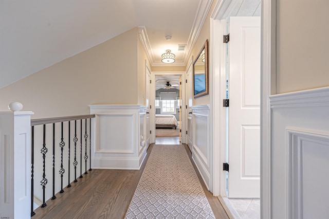 hall featuring wood-type flooring and crown molding