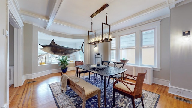 dining area featuring beam ceiling, crown molding, light hardwood / wood-style flooring, and coffered ceiling