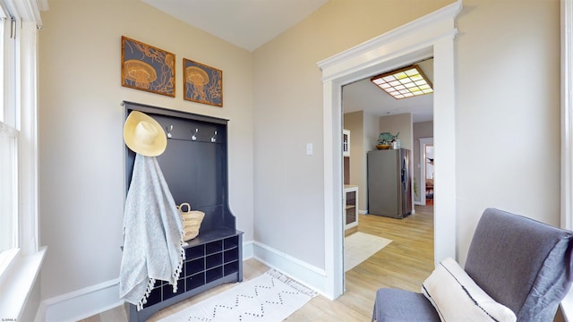 mudroom with light hardwood / wood-style floors