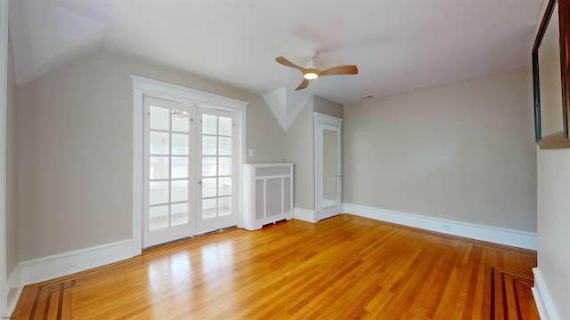 additional living space featuring ceiling fan, vaulted ceiling, and hardwood / wood-style flooring