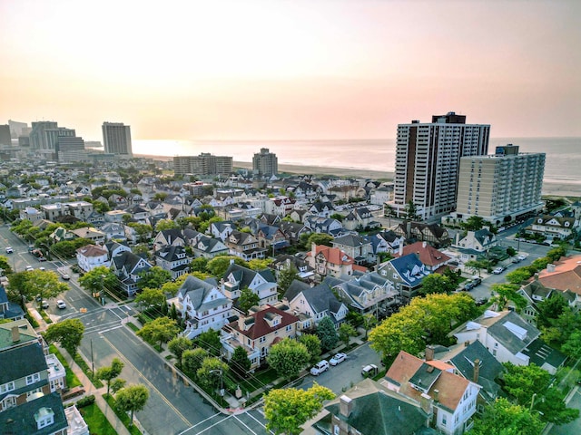 aerial view at dusk with a water view