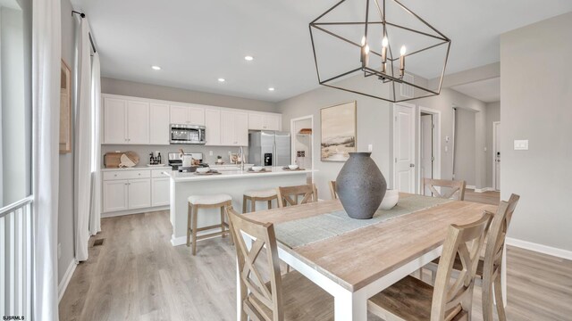 dining room featuring light hardwood / wood-style floors