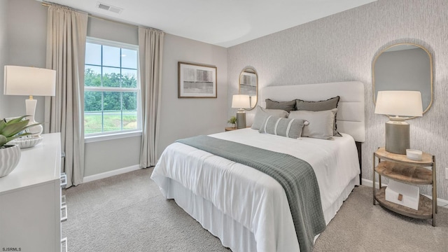 bedroom featuring light colored carpet