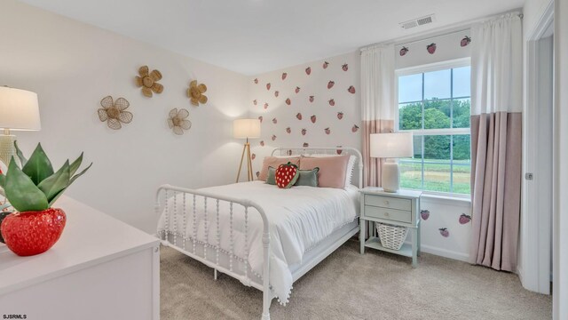 bedroom featuring light carpet