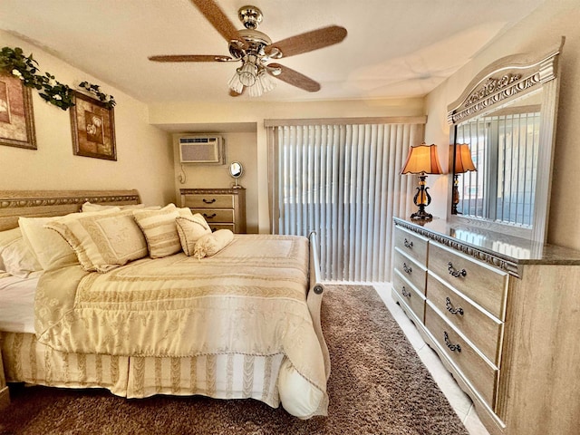 carpeted bedroom with ceiling fan and a wall mounted air conditioner