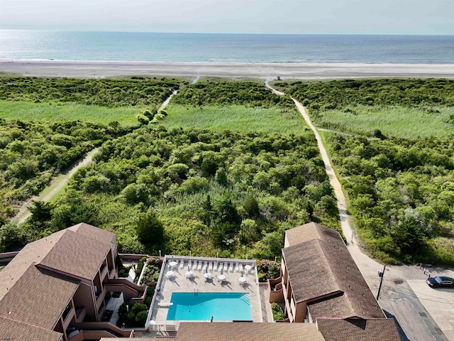 drone / aerial view featuring a beach view and a water view