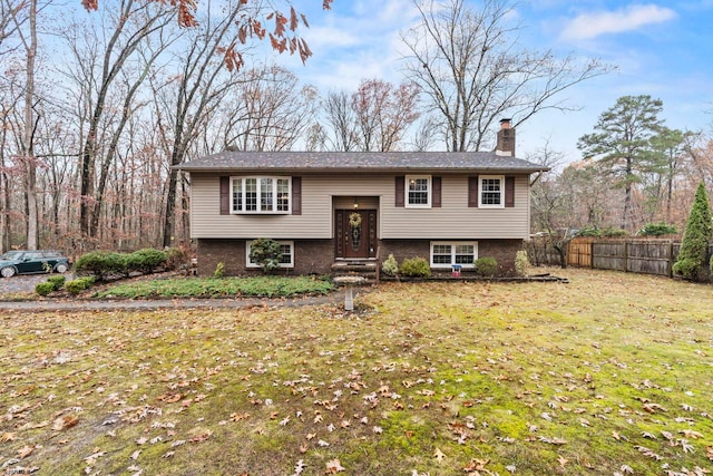 bi-level home with a front yard