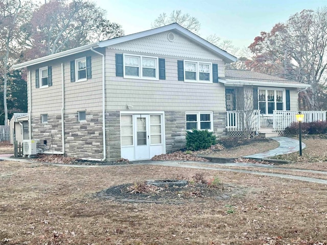 view of front of house with ac unit