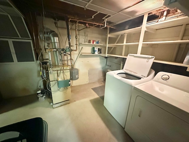 laundry room featuring washing machine and dryer