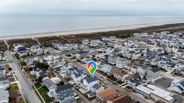 bird's eye view with a view of the beach and a water view