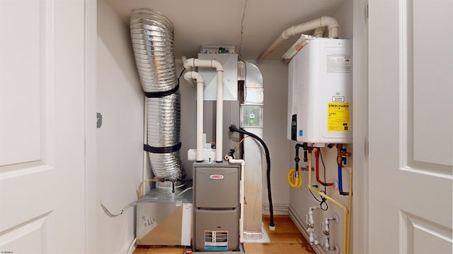 utility room with tankless water heater