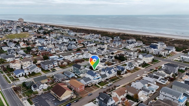 aerial view featuring a water view and a view of the beach