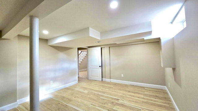 basement featuring light wood-type flooring