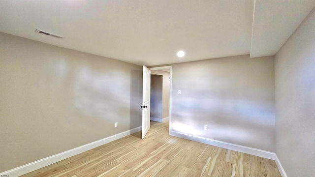 unfurnished room with light hardwood / wood-style floors