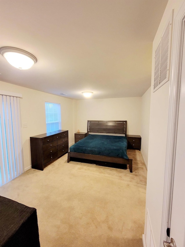 bedroom with light colored carpet