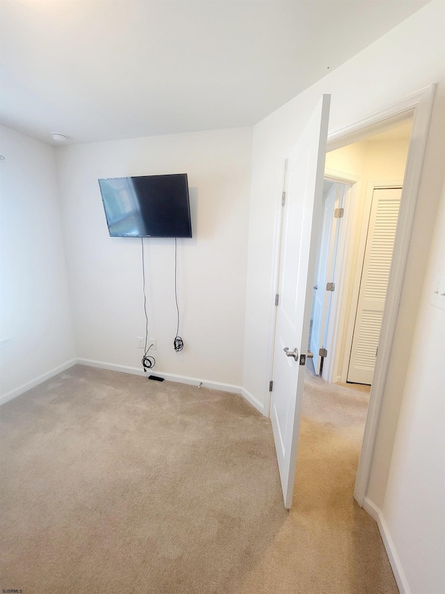 basement with light colored carpet