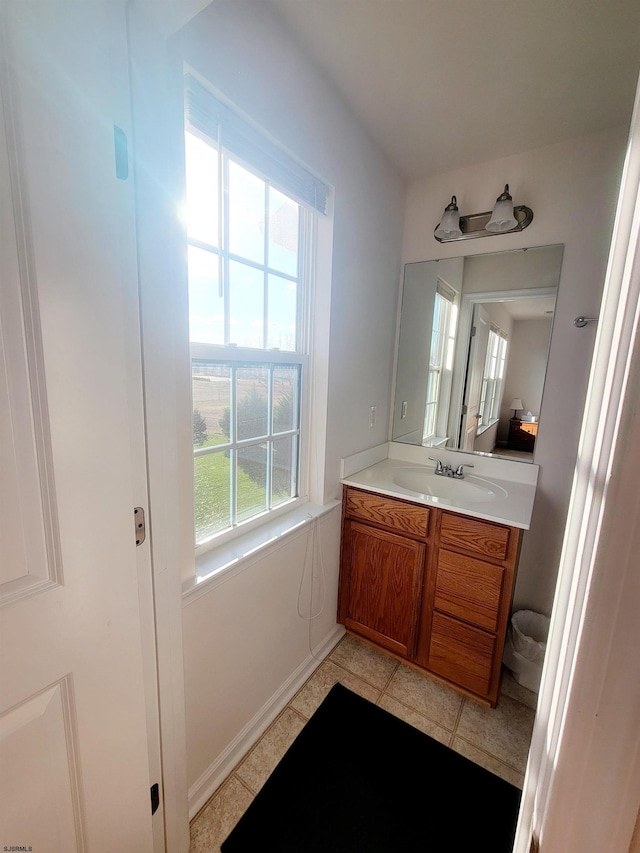 bathroom with tile patterned floors and vanity