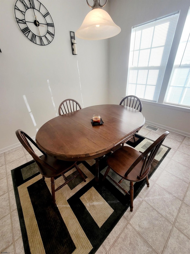 dining room featuring light tile patterned floors