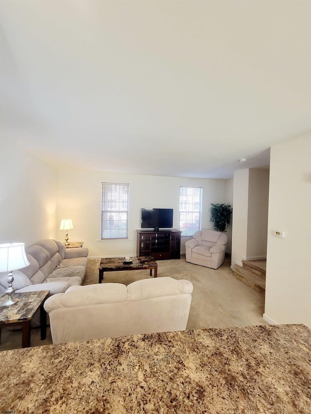 living room featuring light colored carpet