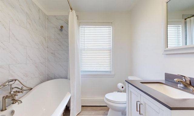 bathroom featuring hardwood / wood-style floors, a bathing tub, baseboard heating, and a wealth of natural light