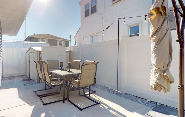 view of patio / terrace with a storage shed