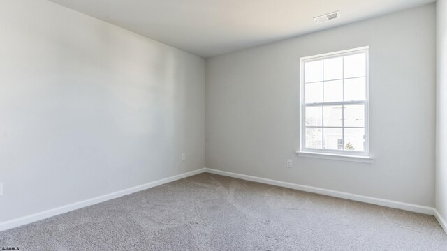 empty room with carpet flooring