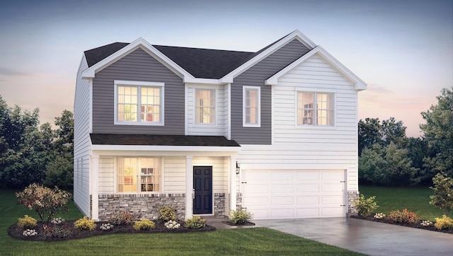 view of front of property featuring a lawn and a garage