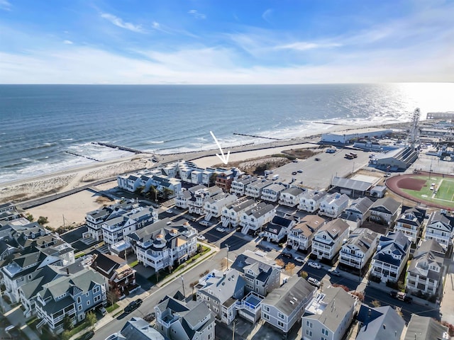 bird's eye view with a water view and a view of the beach