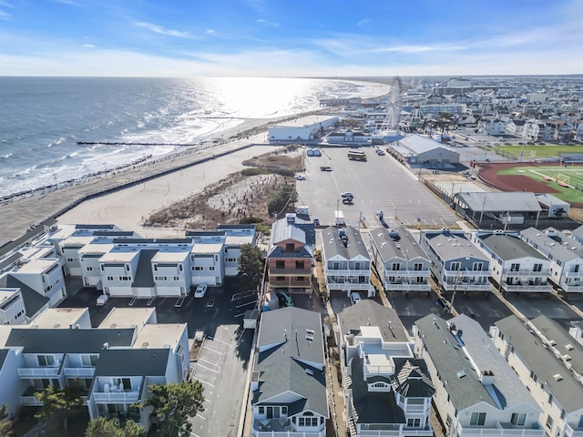 birds eye view of property featuring a water view and a view of the beach