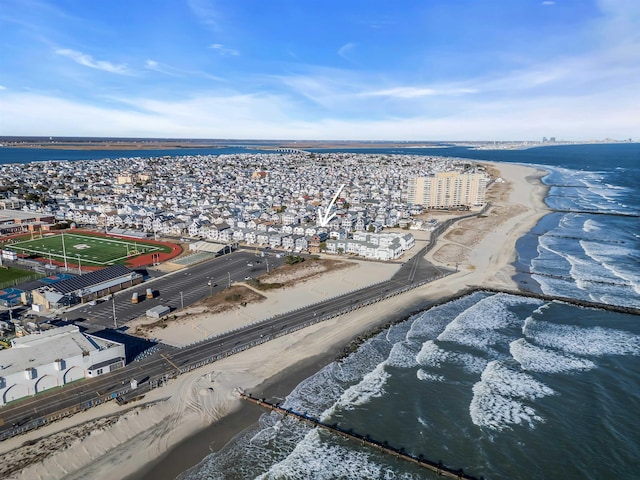 bird's eye view with a water view and a view of the beach