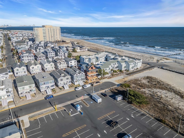 bird's eye view with a view of the beach and a water view