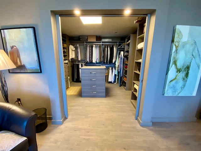 walk in closet featuring light hardwood / wood-style floors