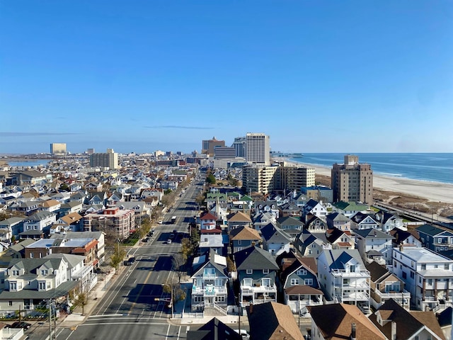 aerial view with a water view and a view of the beach