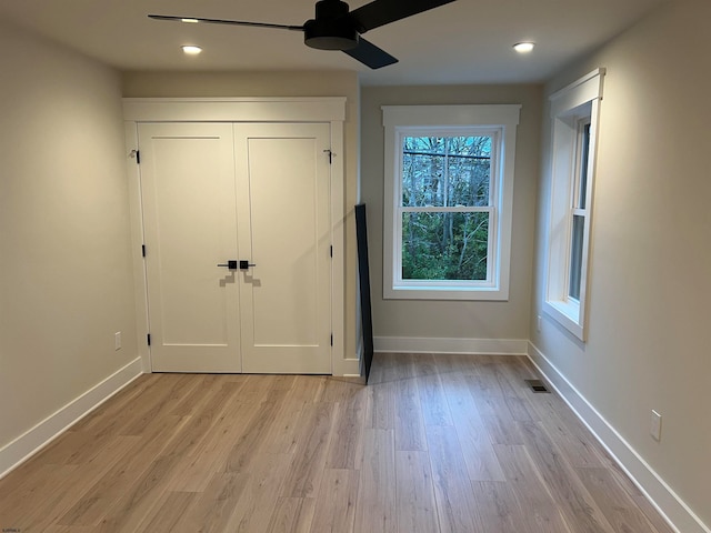 doorway to outside featuring light hardwood / wood-style floors and ceiling fan