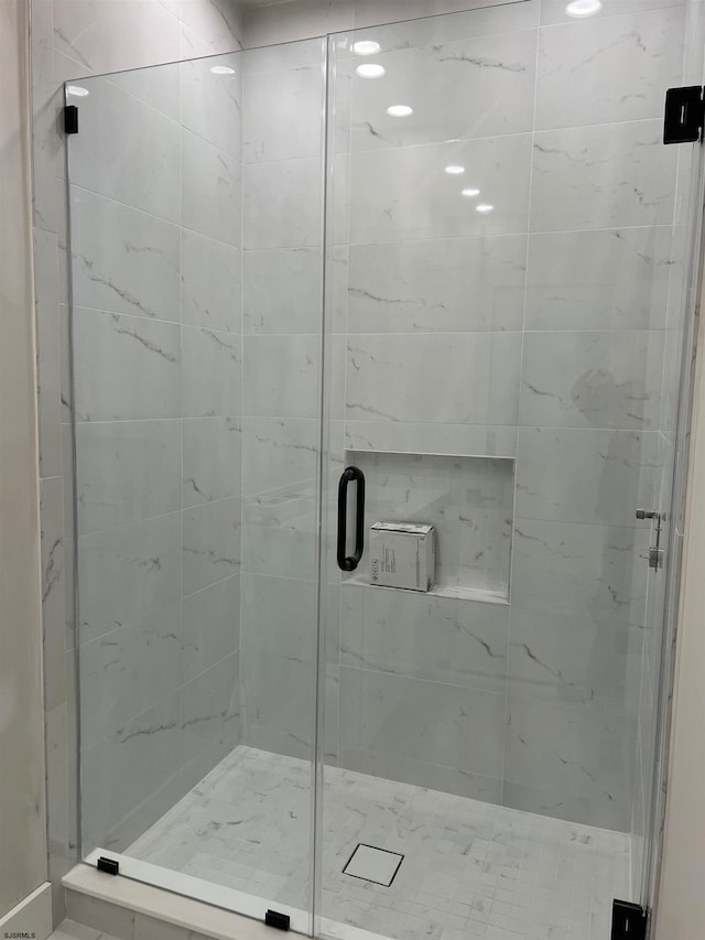 bathroom featuring an enclosed shower