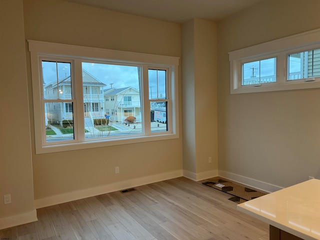 unfurnished room featuring light hardwood / wood-style floors