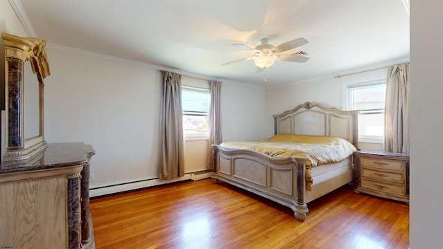 bedroom with hardwood / wood-style floors, ceiling fan, crown molding, and a baseboard radiator