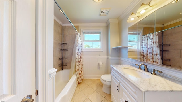 full bathroom with tile patterned flooring, toilet, shower / bath combo with shower curtain, vanity, and ornamental molding