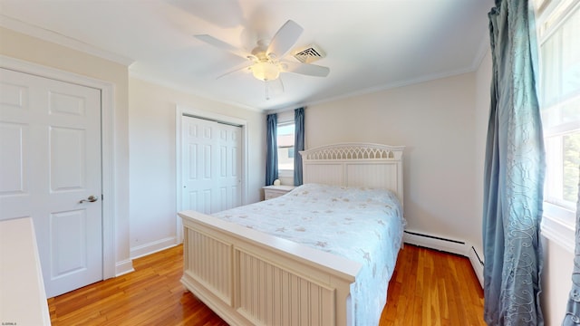 bedroom featuring ceiling fan, a baseboard radiator, crown molding, light hardwood / wood-style floors, and a closet