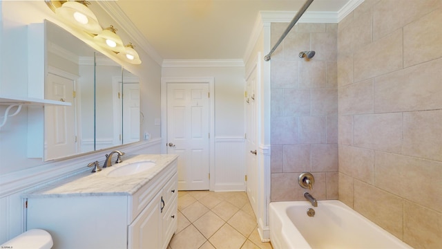 bathroom featuring vanity, tiled shower / bath combo, crown molding, and tile patterned flooring