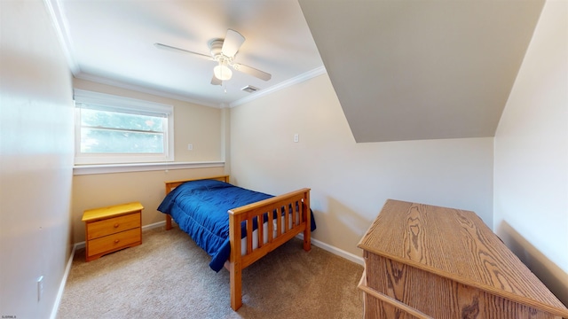 carpeted bedroom with ceiling fan and ornamental molding