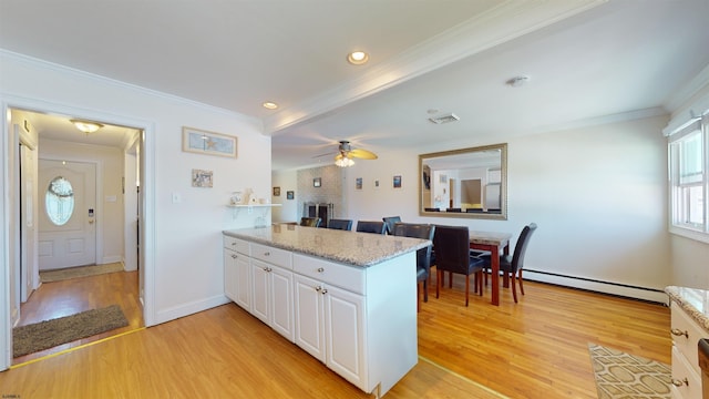 kitchen featuring a baseboard radiator, light hardwood / wood-style flooring, kitchen peninsula, white cabinets, and ornamental molding